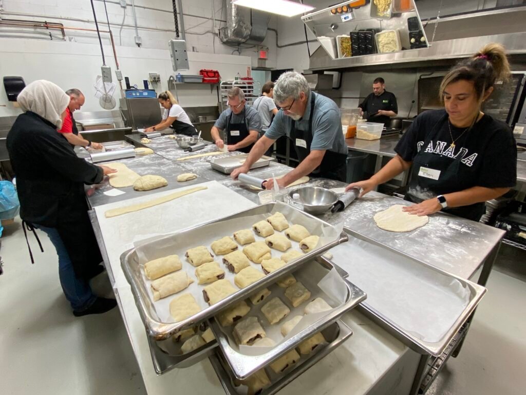 People preparing food in the kitchen